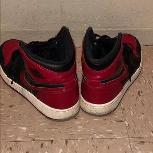 Black white and red Jordan ones